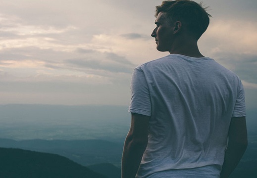man-staring-distance